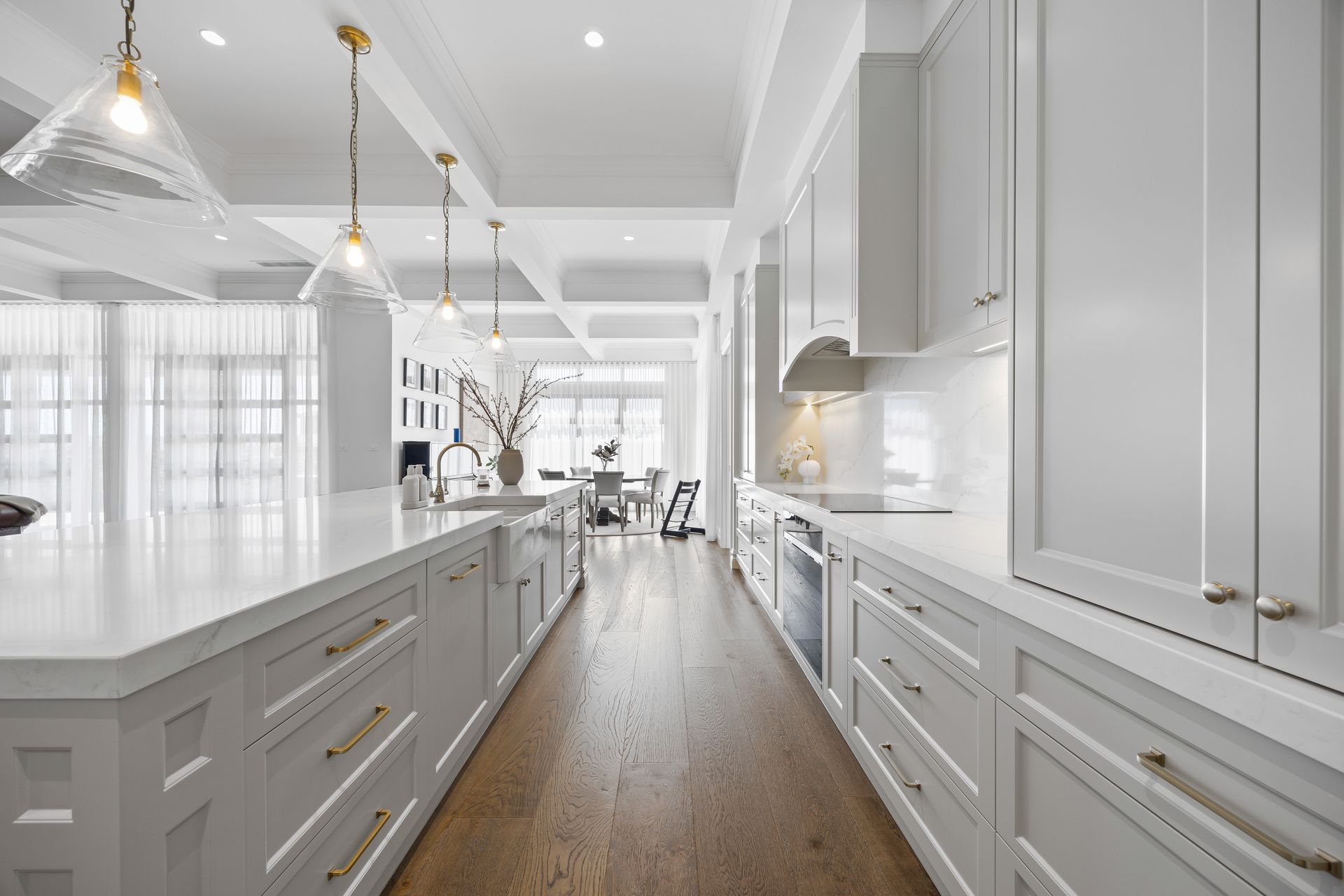 Shaker-style cabinetry with brushed hardware and stone tops