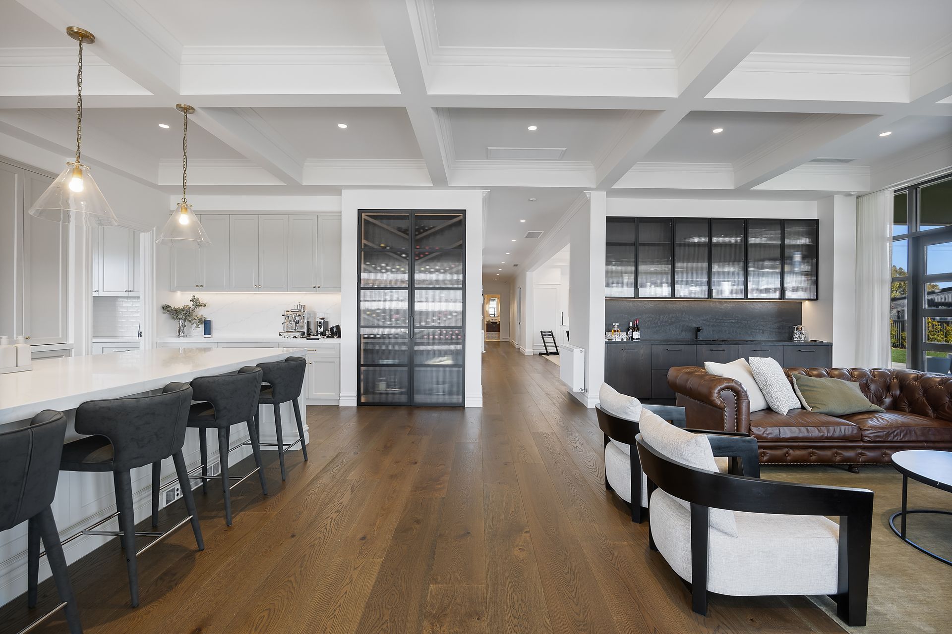 Wide view of kitchen, dining and living zones