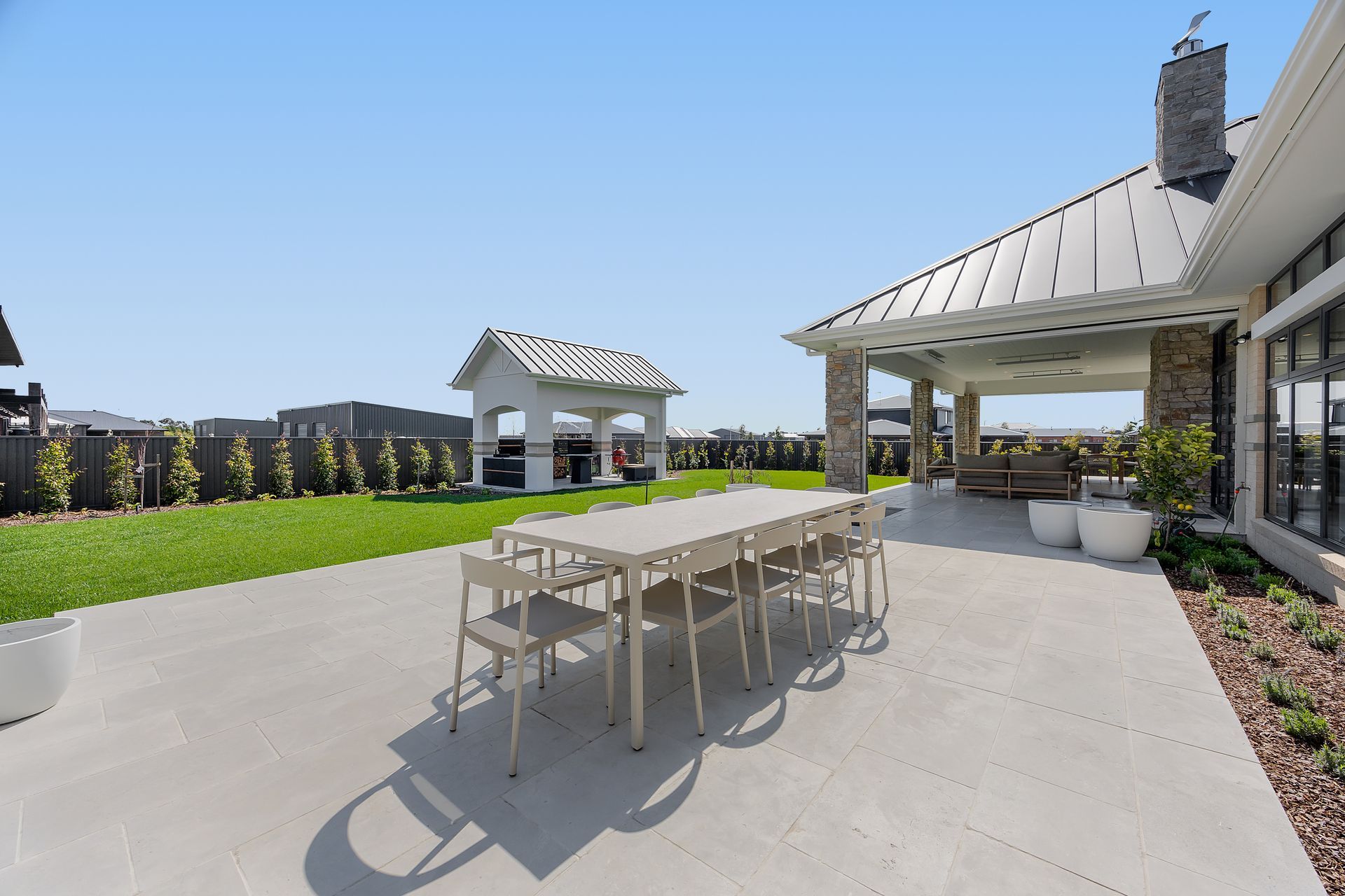 Rear alfresco area with outdoor dining setup