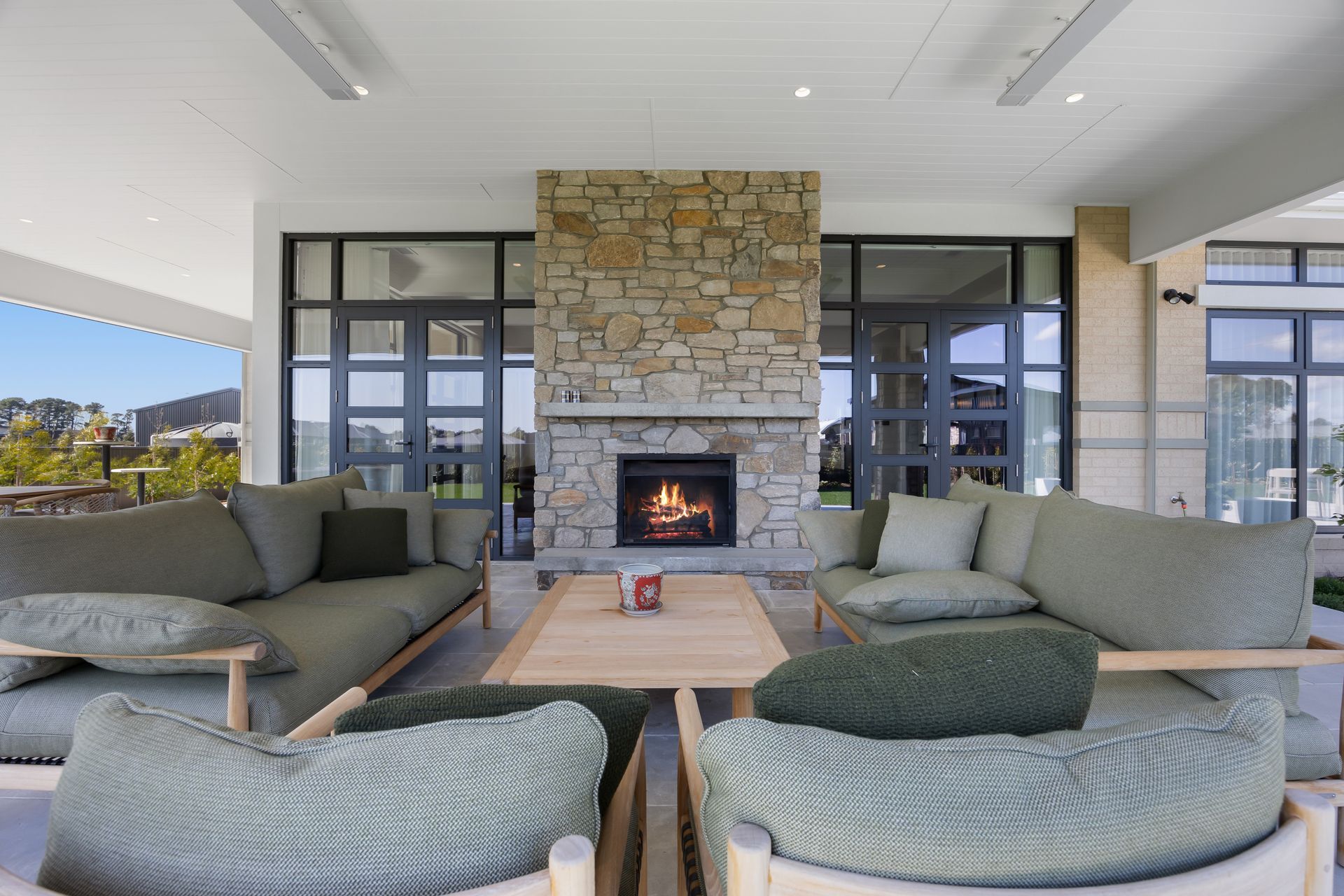Exterior living area with fire feature and relaxed seating