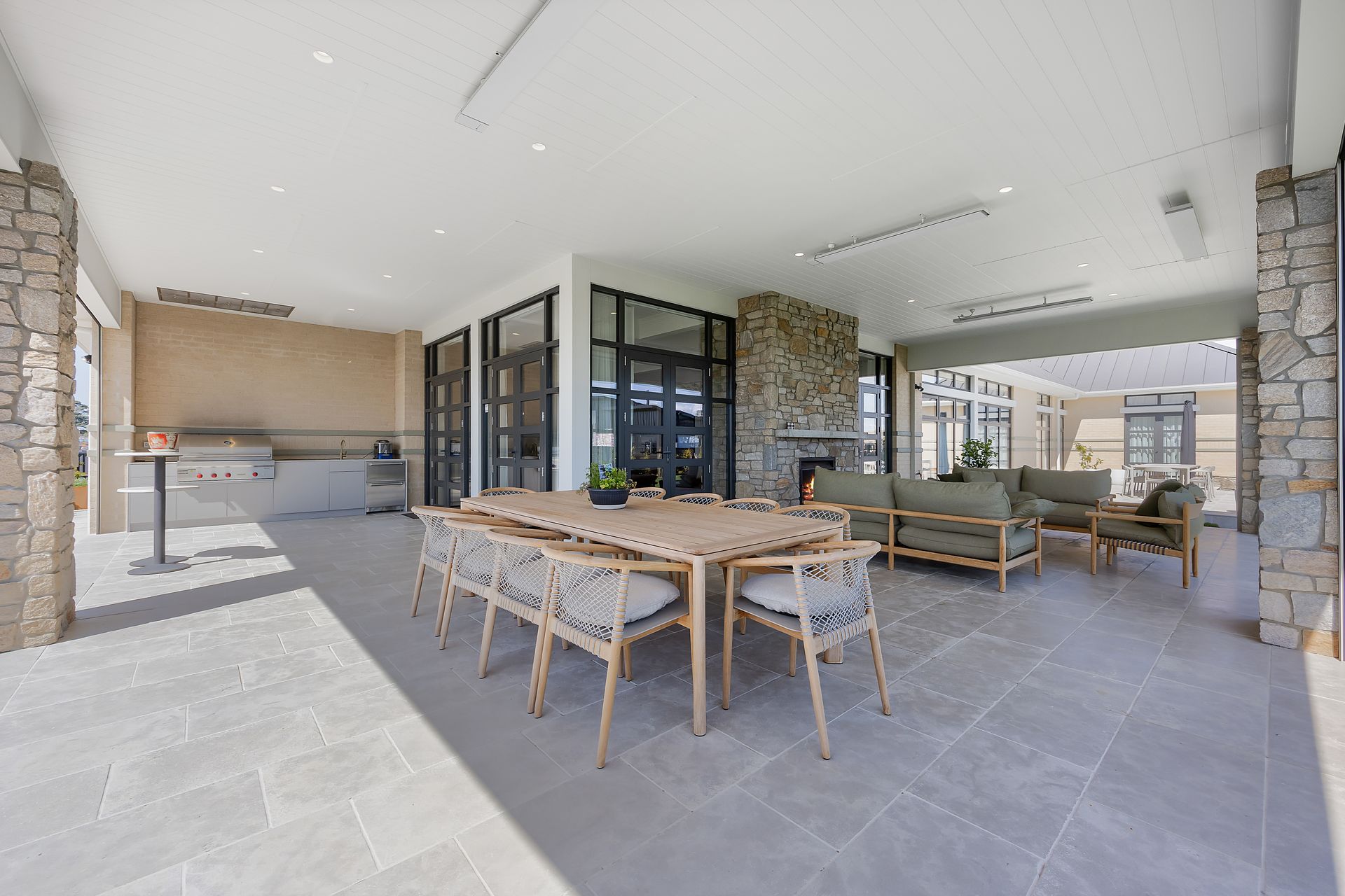 Exterior living area with fire feature and relaxed seating