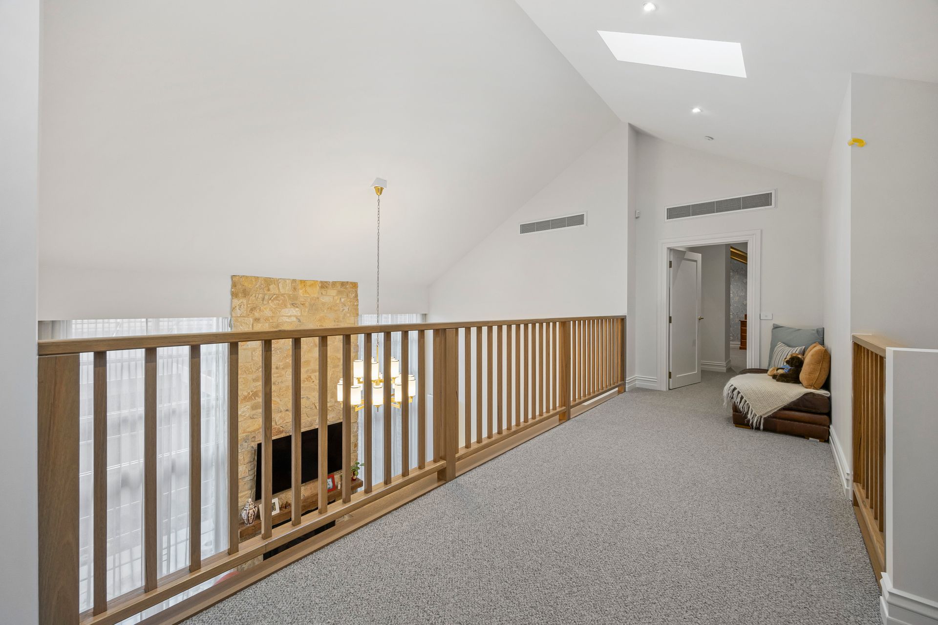 Upper floor landing with balustrade and skylights