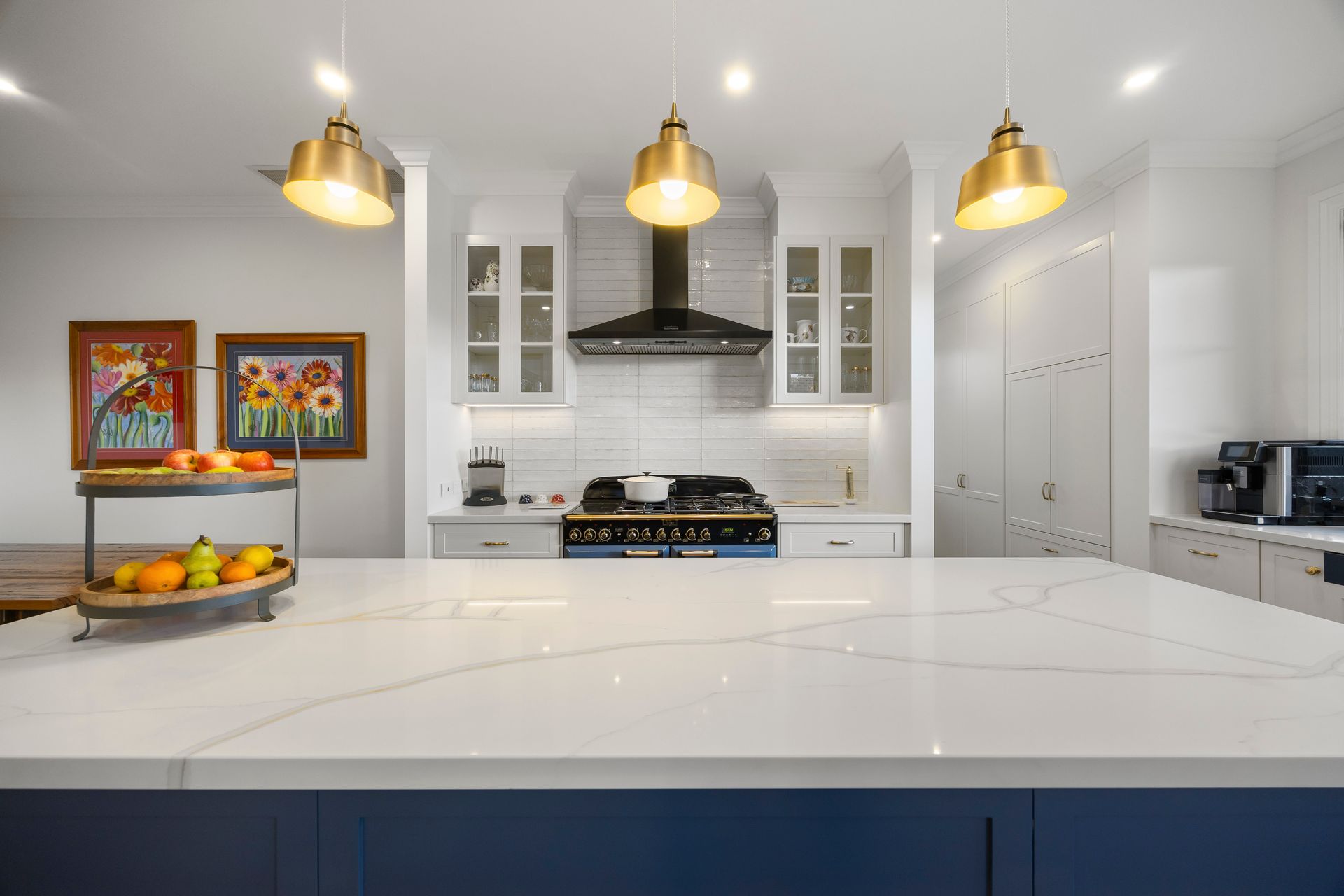 Cooktop and splashback detail with shaker cabinetry and open shelving