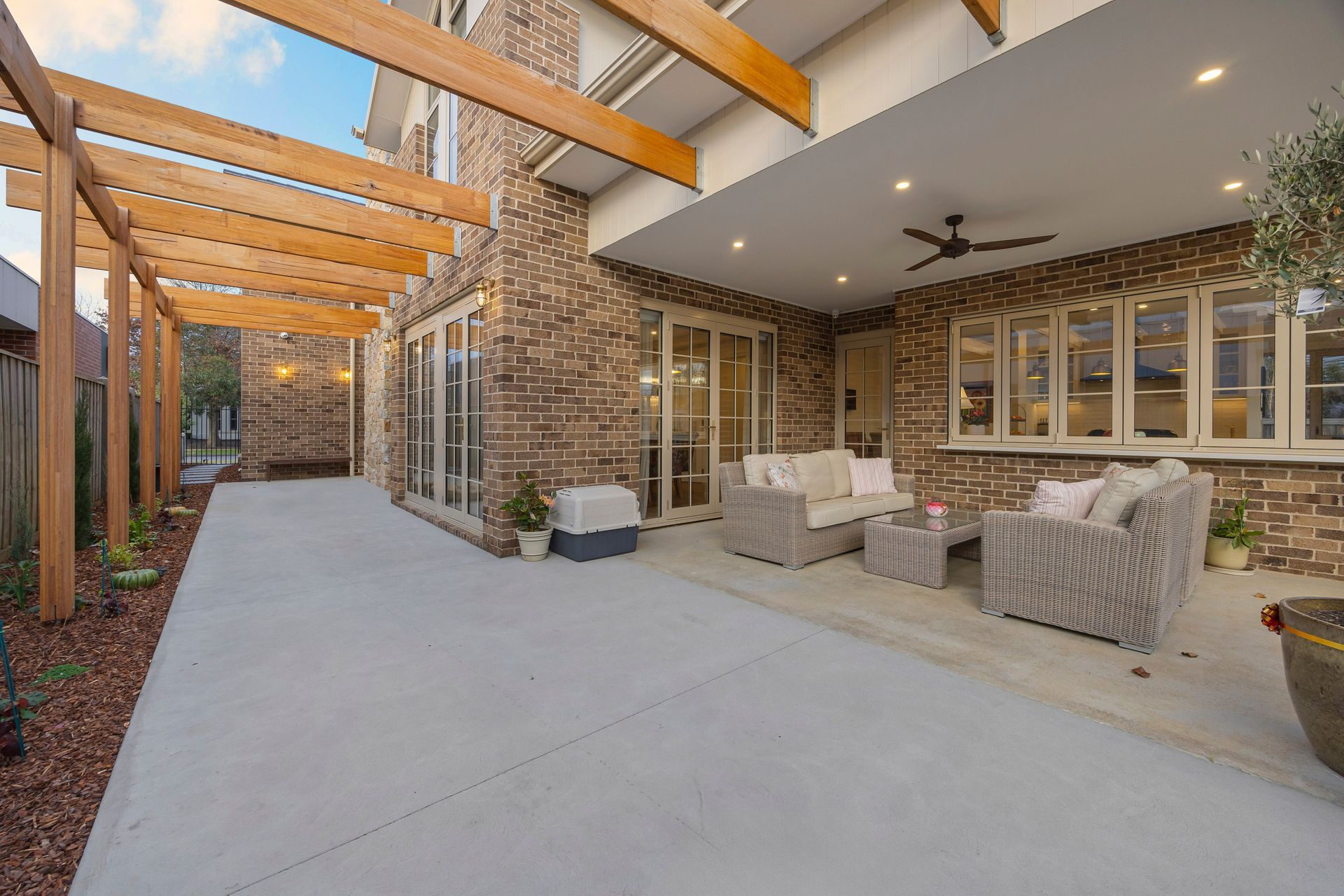 Outdoor living area with pergola and alfresco entertaining zone