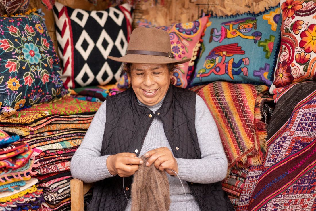 Peruvian woman weaving.