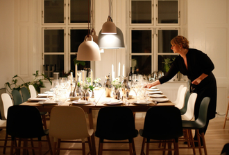 Event staff person preparing a table for a private dinner party in Asheville