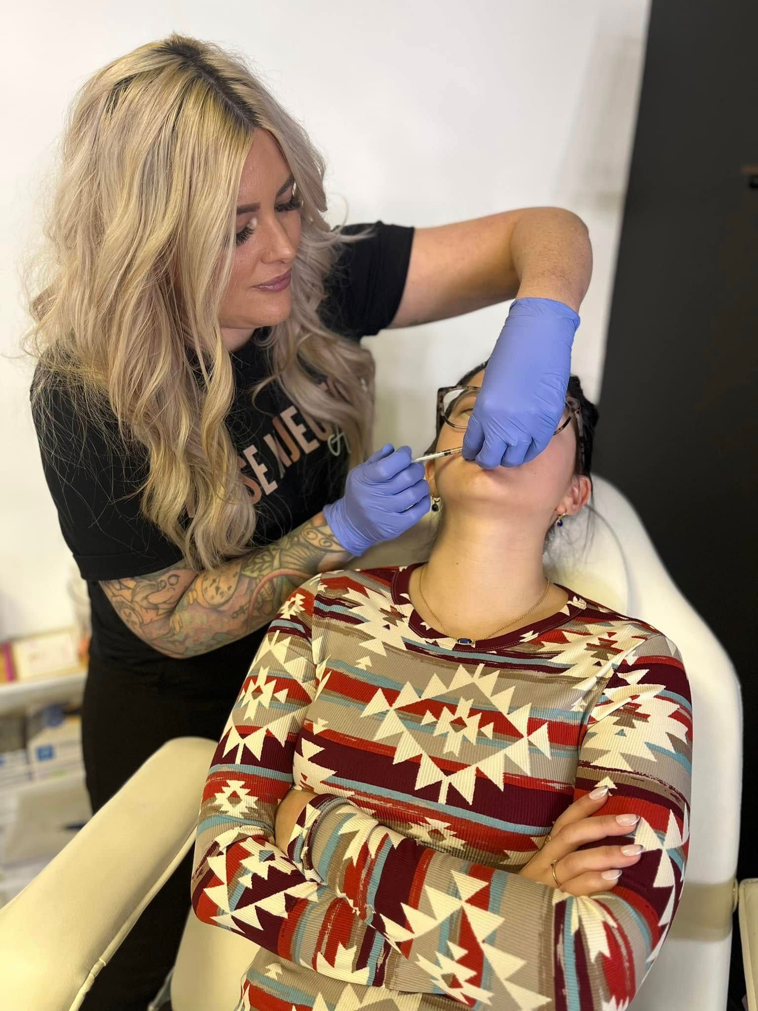 Aesthetic professional providing a cosmetic injectable treatment at a med spa in Springfield, MO.