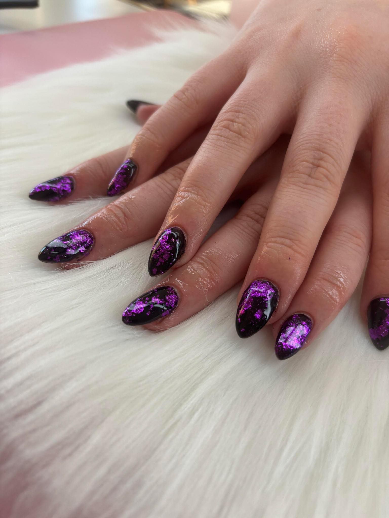 Black and purple custom nail design with metallic accents by a nail artist near Ozark, MO.