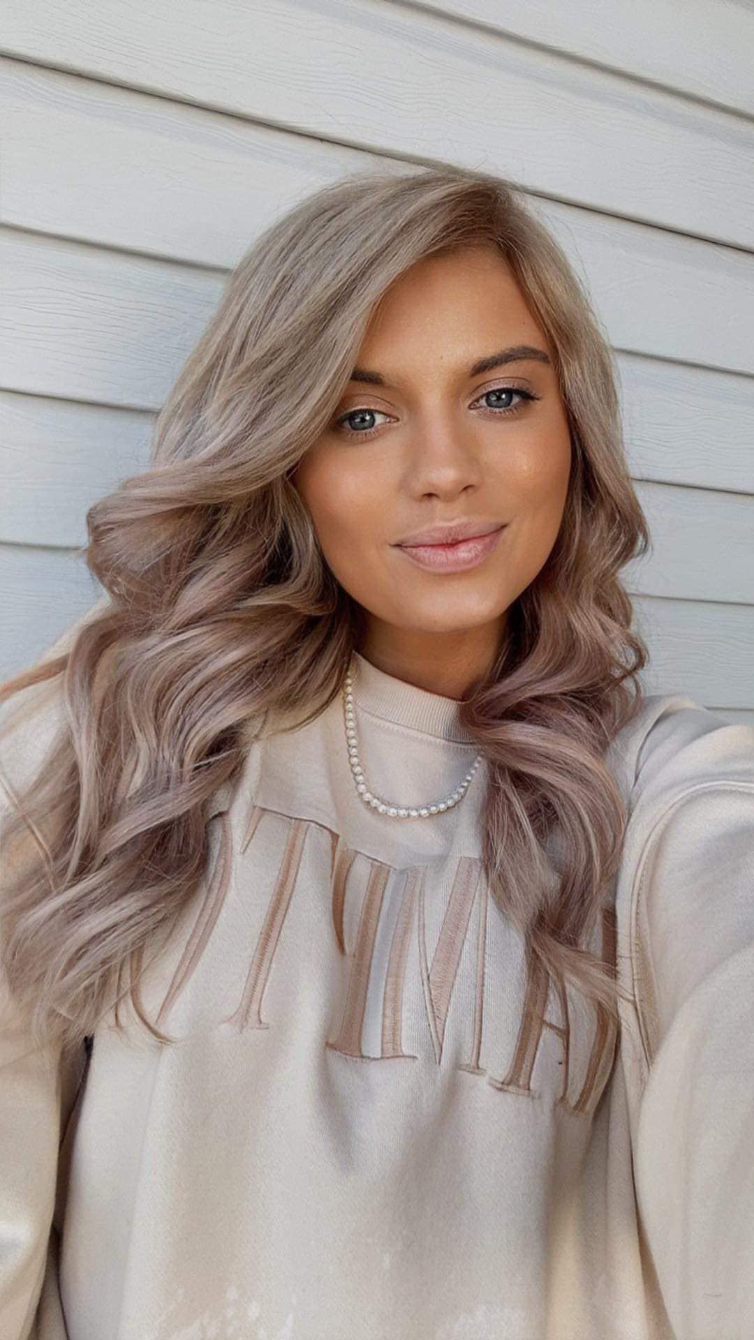 Dimensional ash brown hair color with soft waves by a professional colorist near Republic, MO.