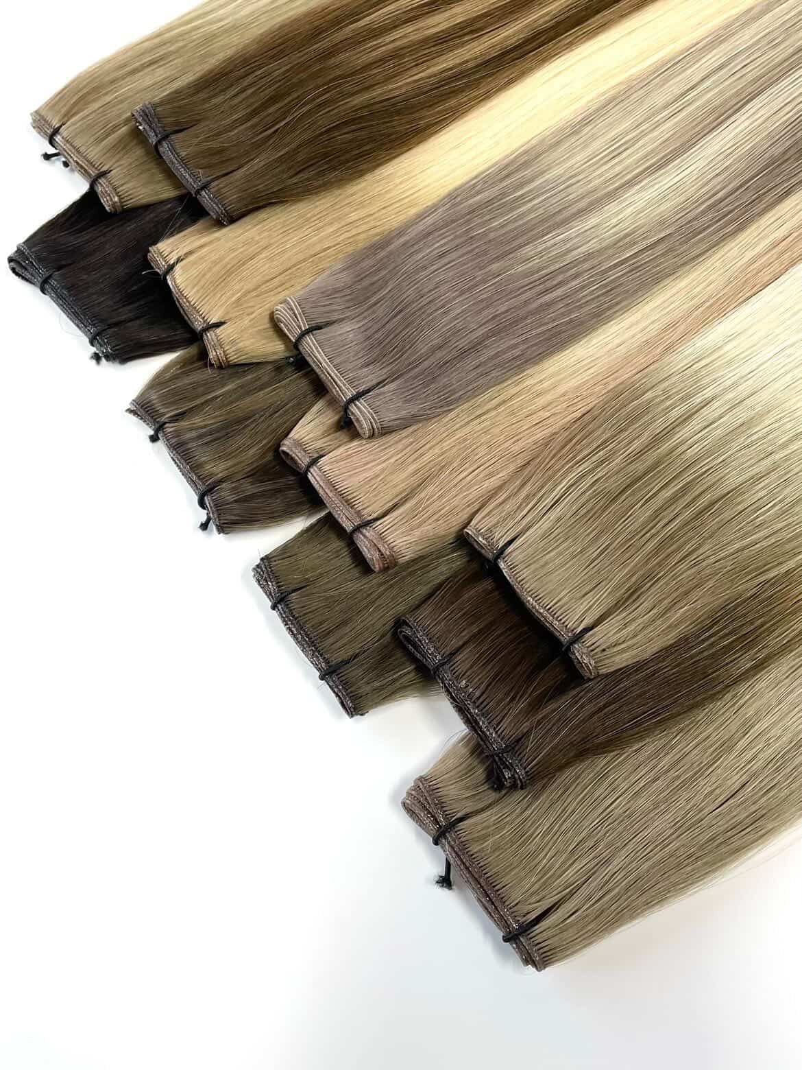 Multiple shades of blonde and brunette hair extension wefts