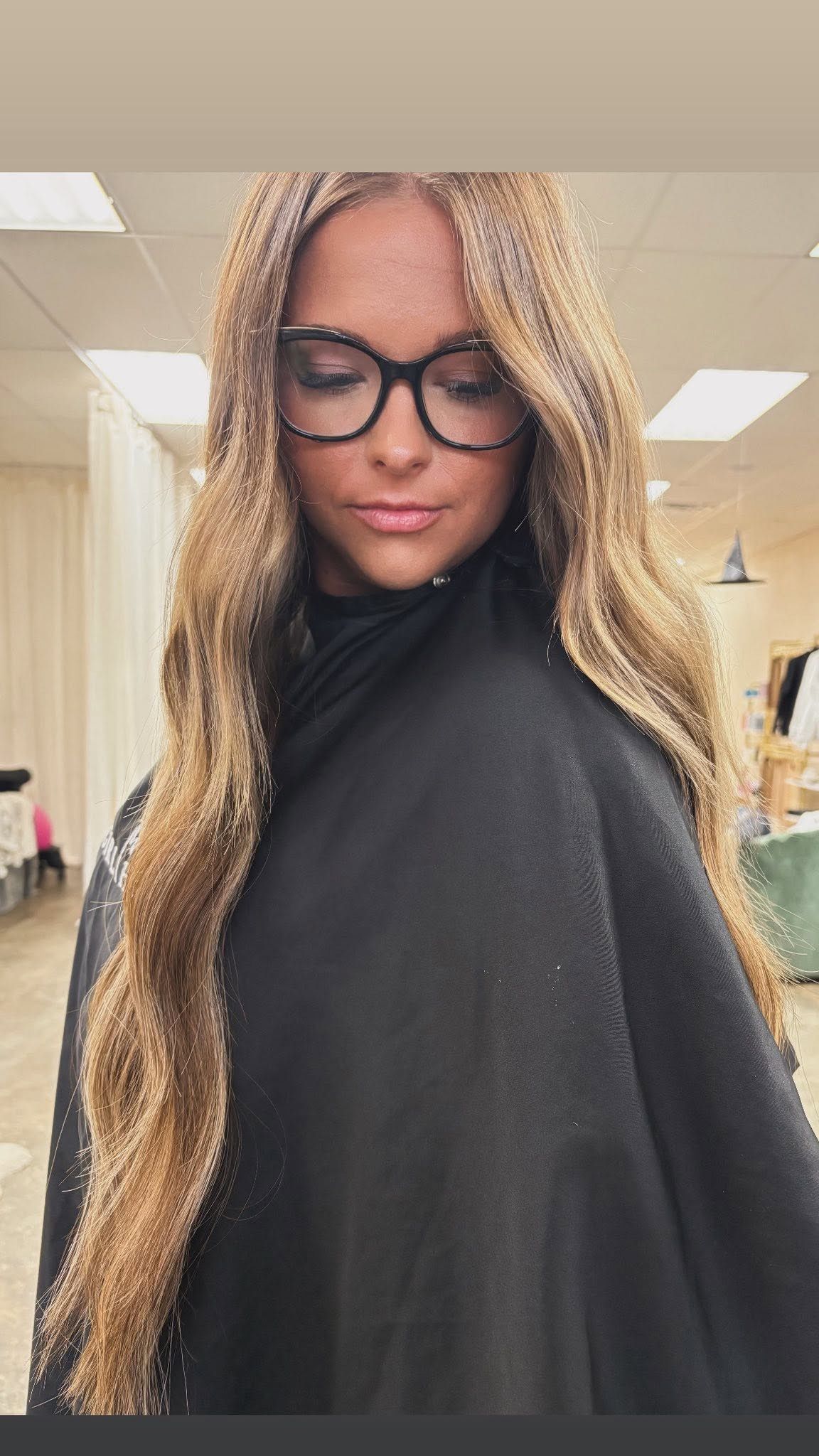 Woman with long blonde hair extensions at The Girl House in Springfield, MO