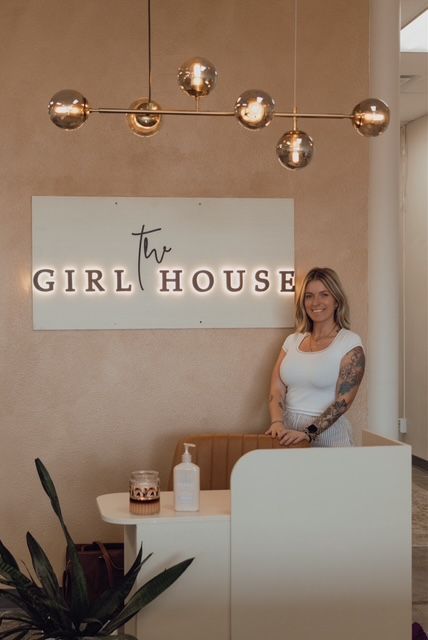 The Girl House beauty salon in Springfield, MO, featuring the reception desk and salon sign.