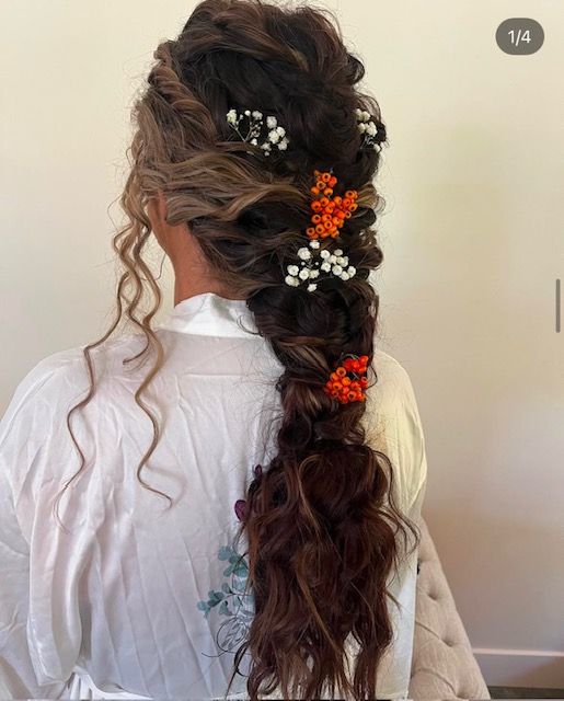 Romantic bridal braid and wedding updo with floral accents by a hair stylist in Brookline, MO.