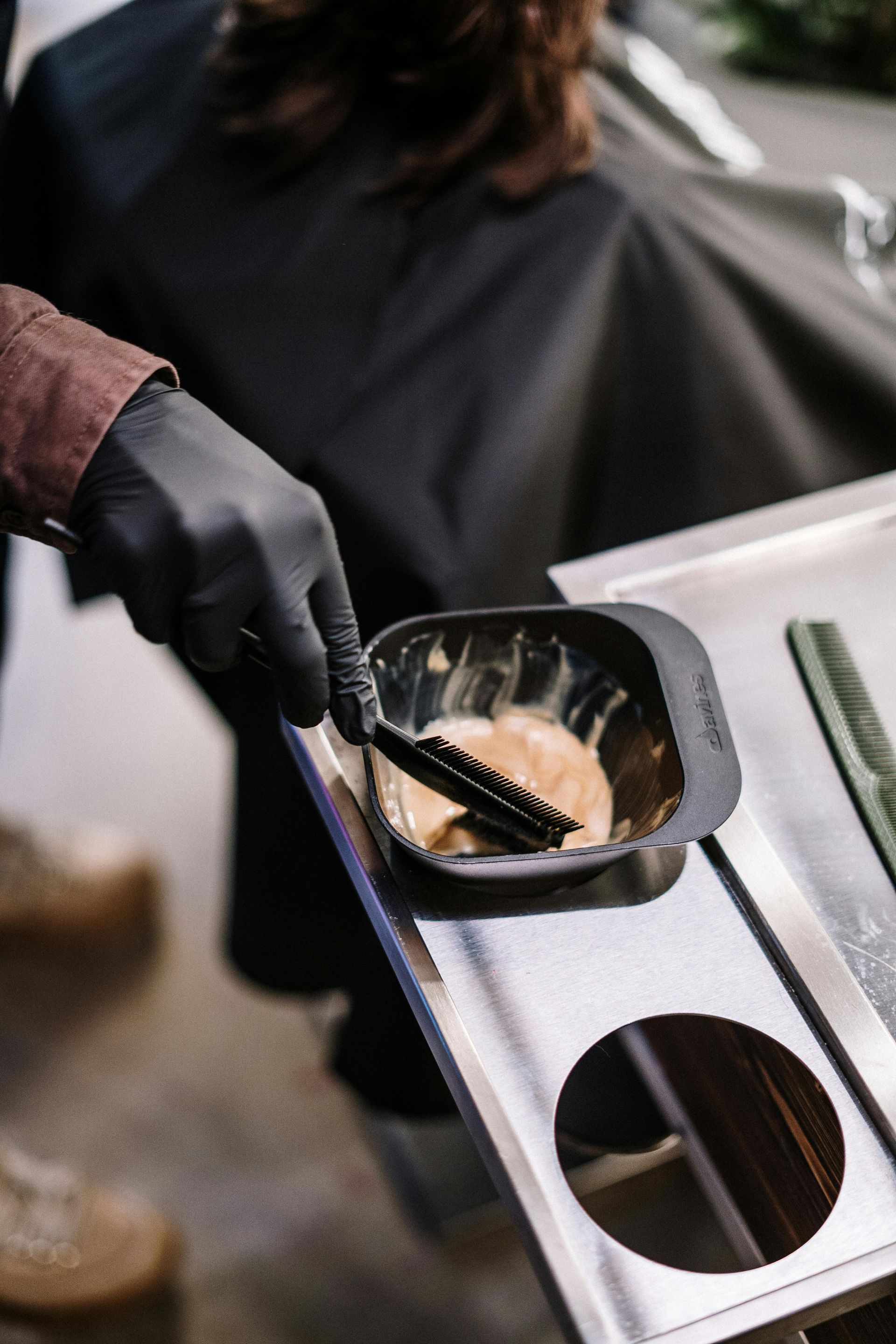 hair stylist mixing hair color | hair color corrections in Springfield MO