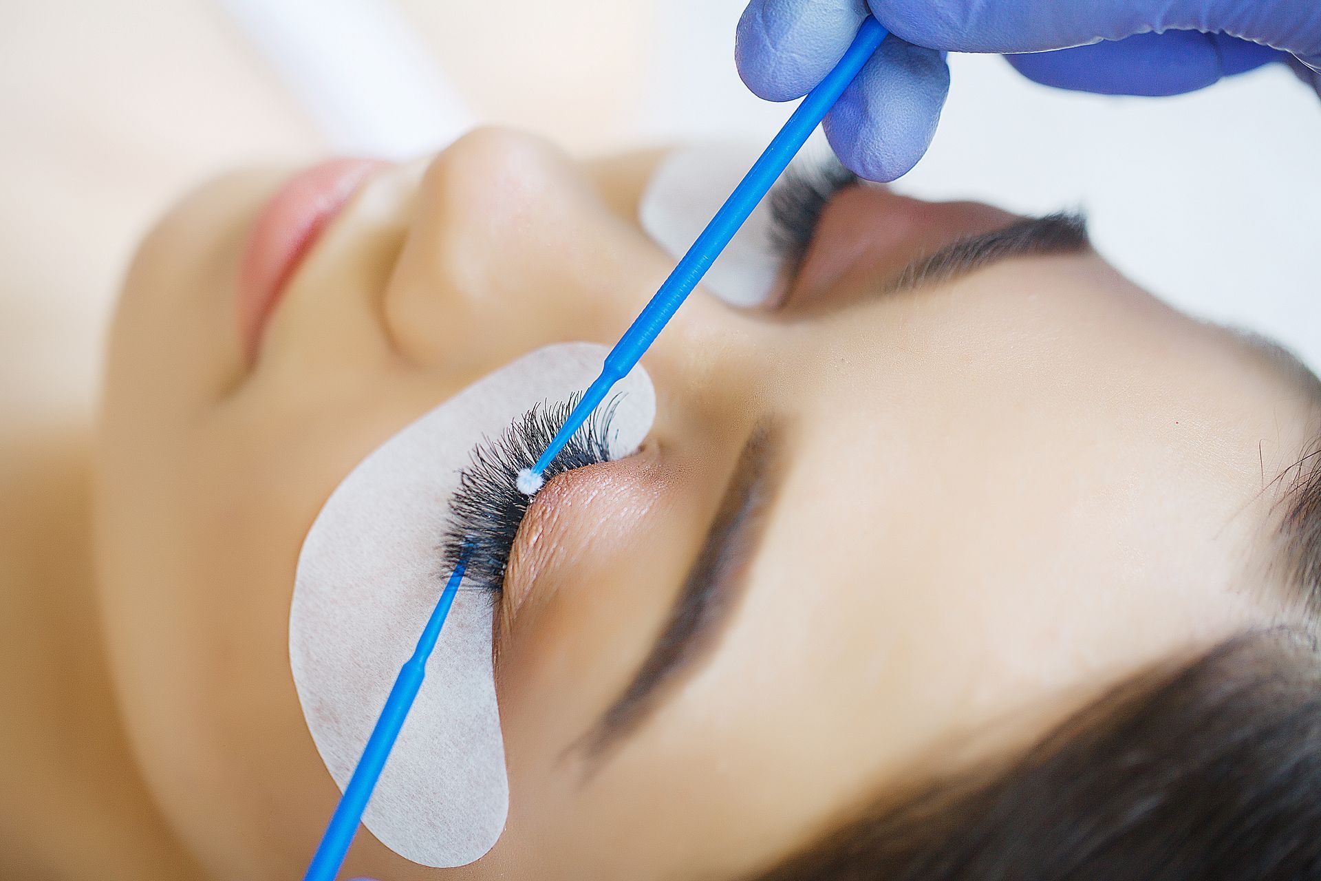 Professional eyelash extension application at a lash salon in Springfield, MO.