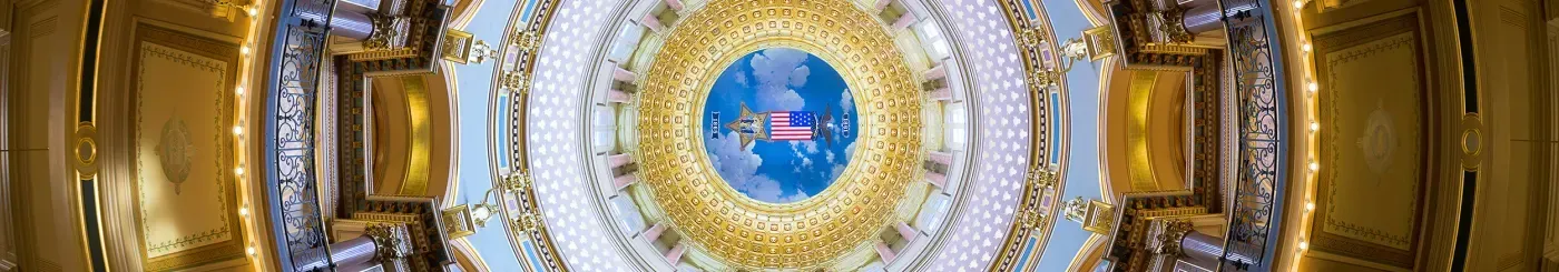 Ornate ceiling with gold and blue decorative elements.