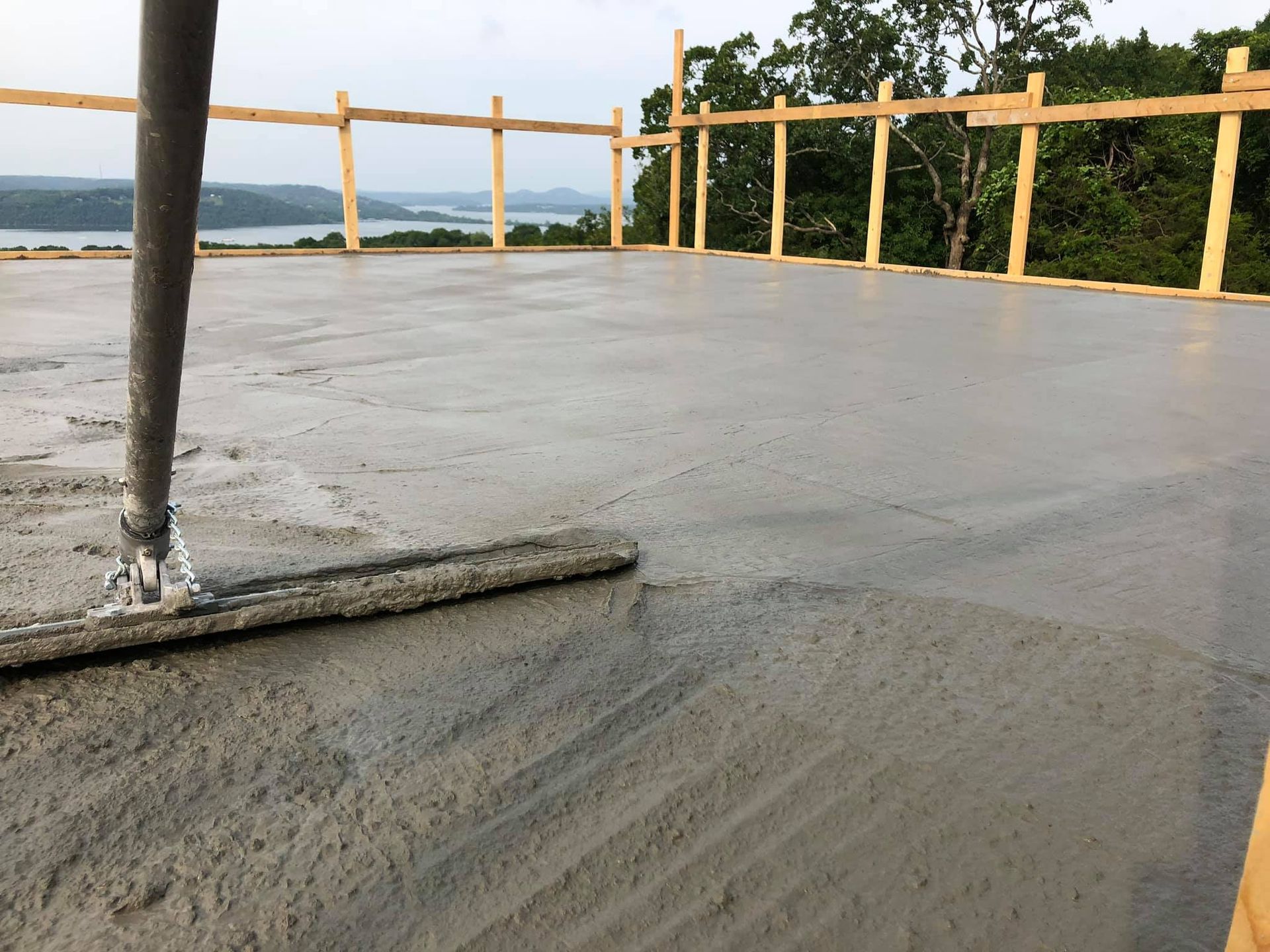 A concrete ICF roof is being poured with a great view- Ozark MO builders