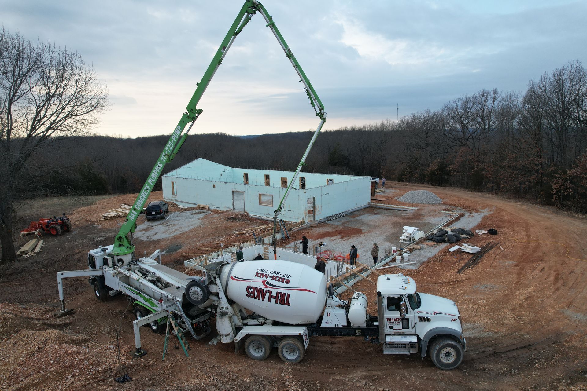 Concrete pump truck on ICF custom home construction site | Branson, MO