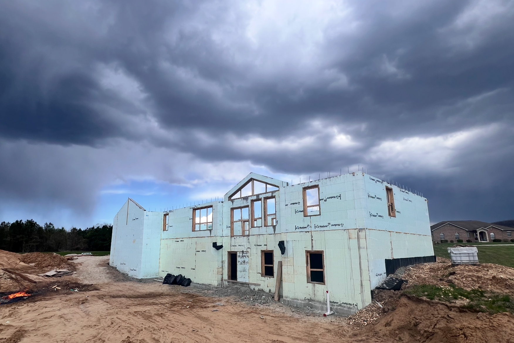 ICF home under construction beneath storm clouds | Hermann, MO
