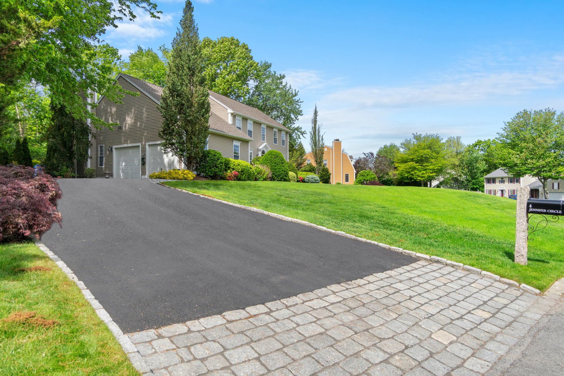 a house with a new paved driveway