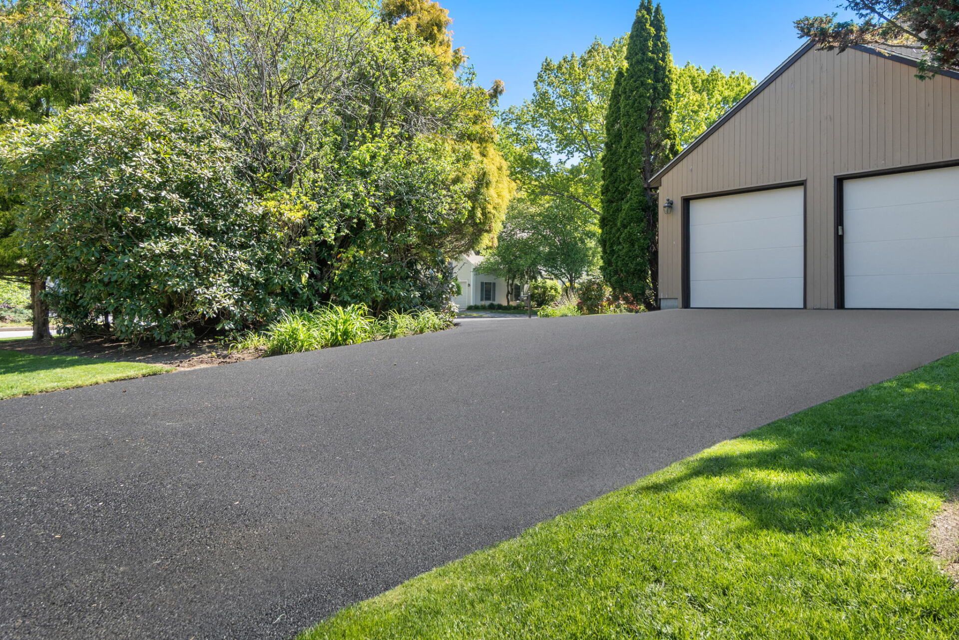a house with a new paved driveway