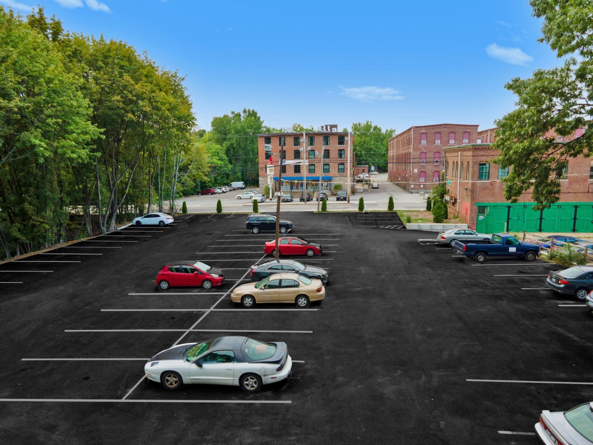 a parking lot with cars with new pavement