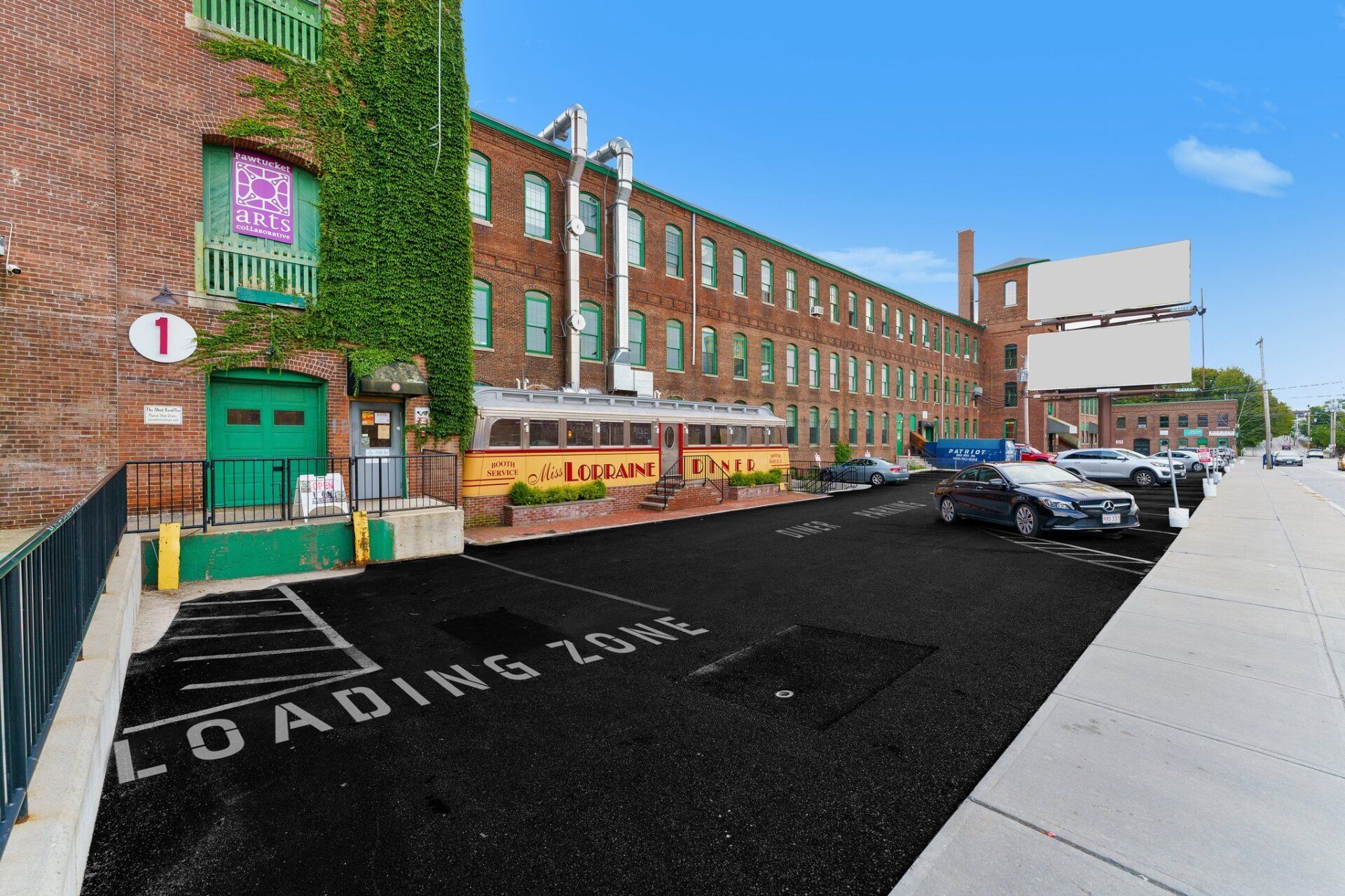 a parking lot with a new paved driveway