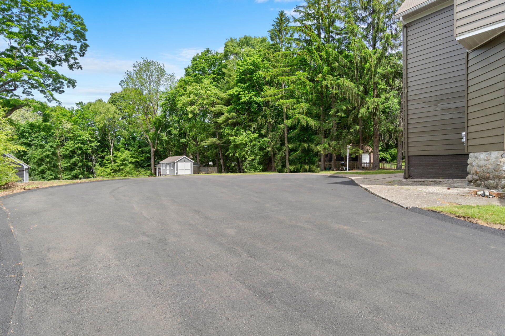 a house with a new paved driveway