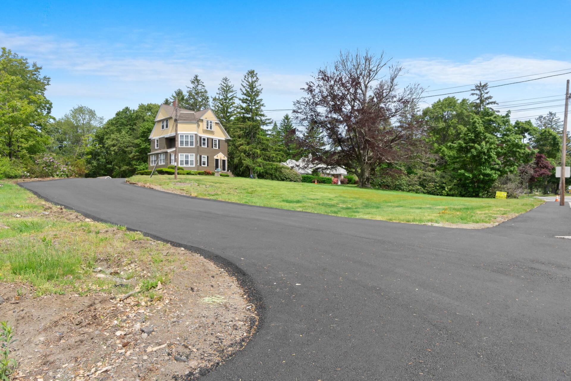 a house with a new paved driveway