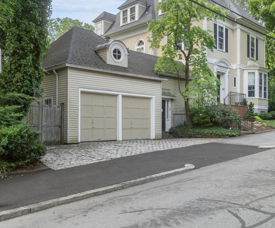 a house with a garage and a new paved driveway