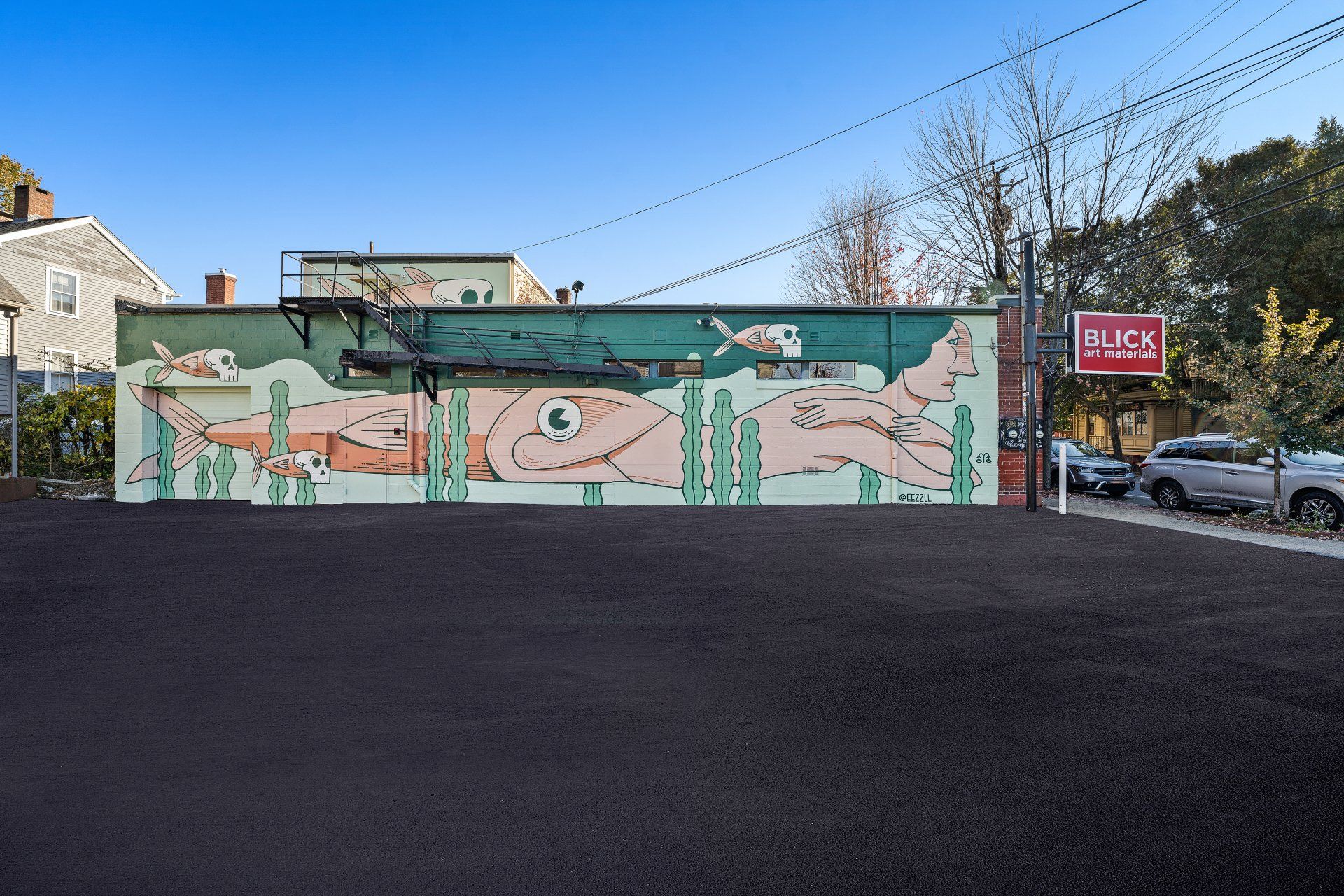 A large mural on the side of a building with a sign that says 44 lx