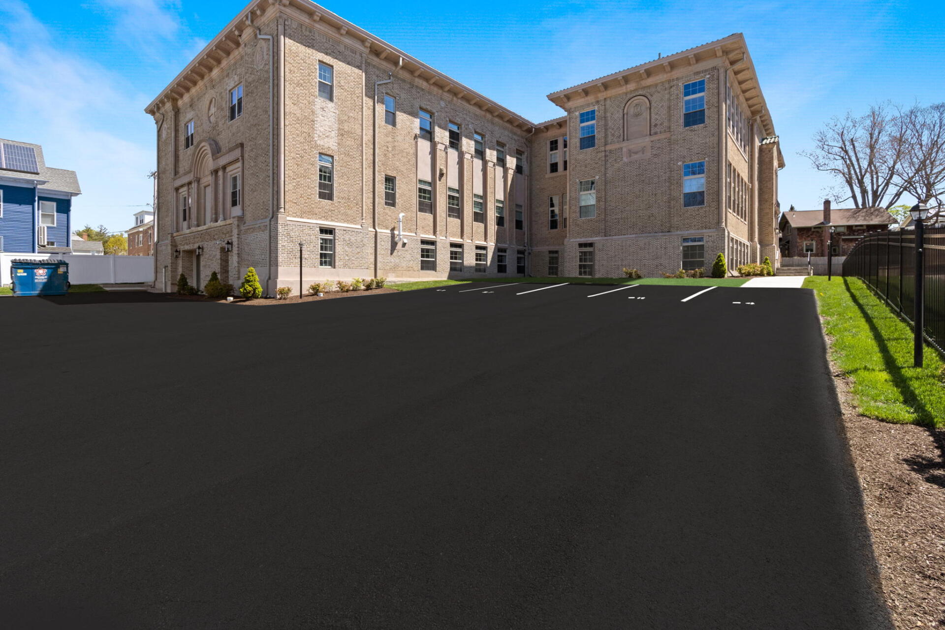 a parking lot with a new paved driveway