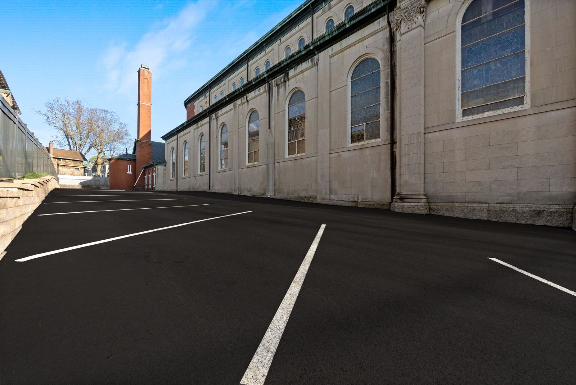 a parking lot with a new paved driveway