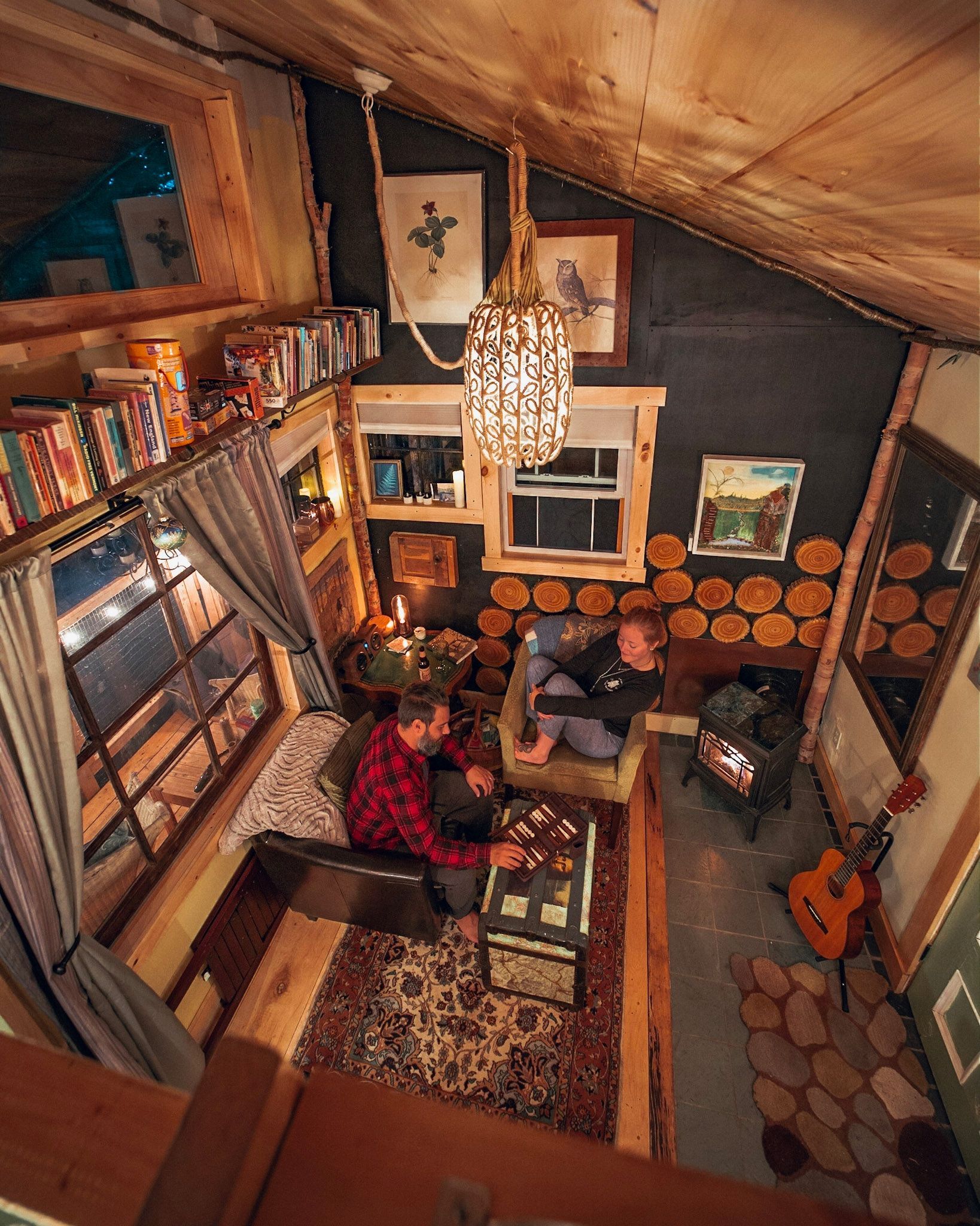 Two people in the living room of the treehouse