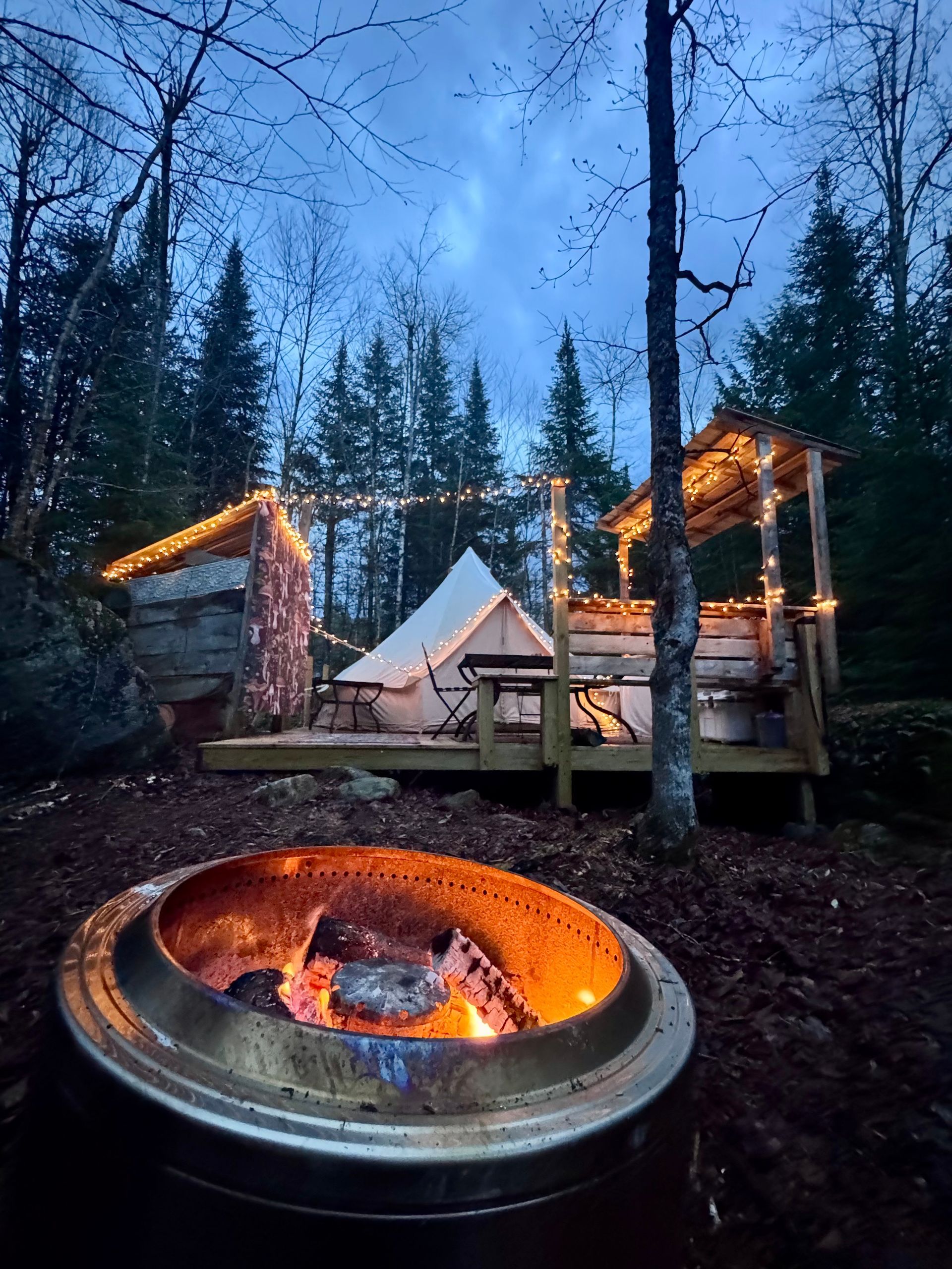 The Pebble Tent site- a canvas tent on a wooden plateform