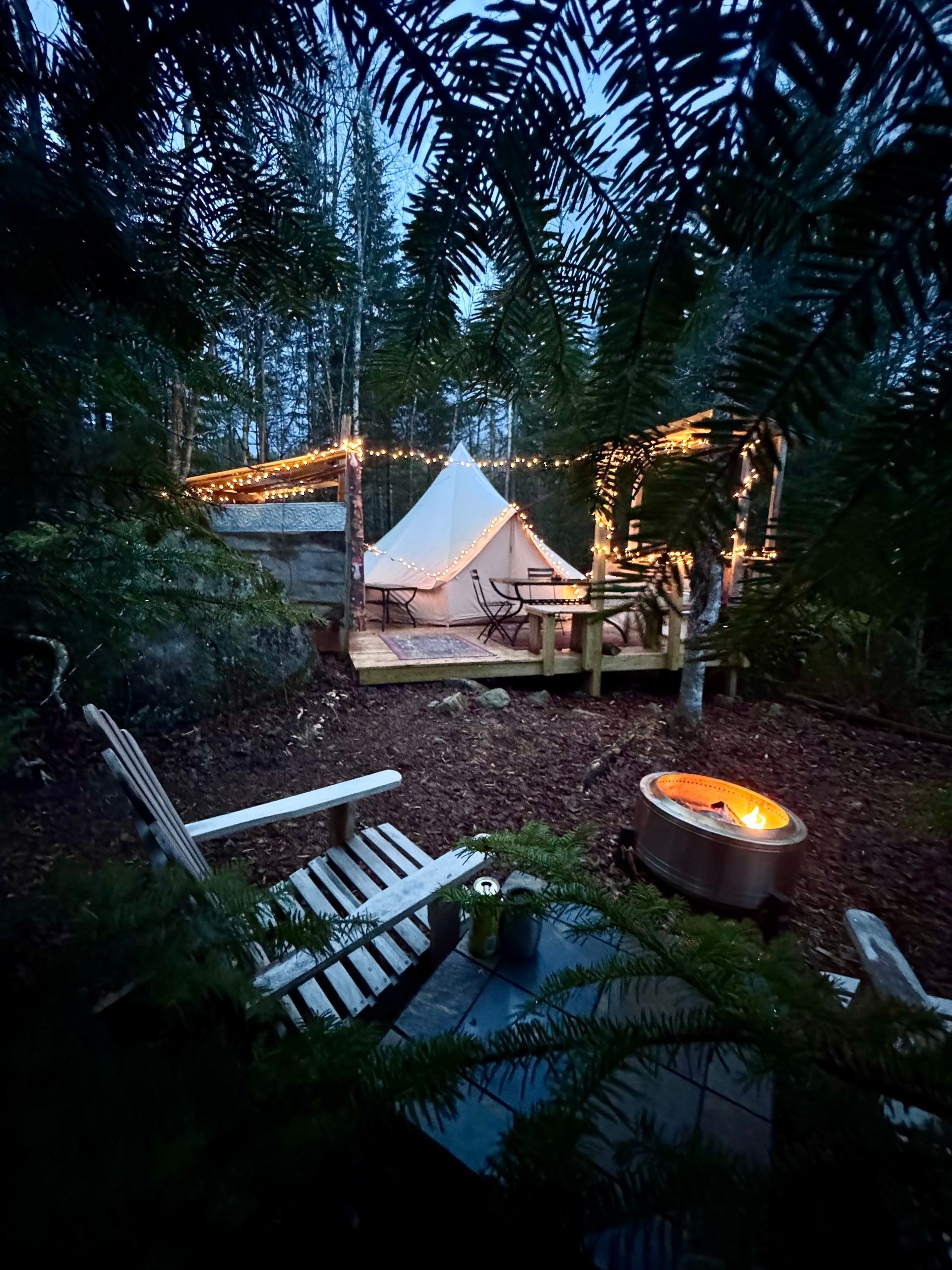 The pebble tent- a canvas tent on a wooden deck