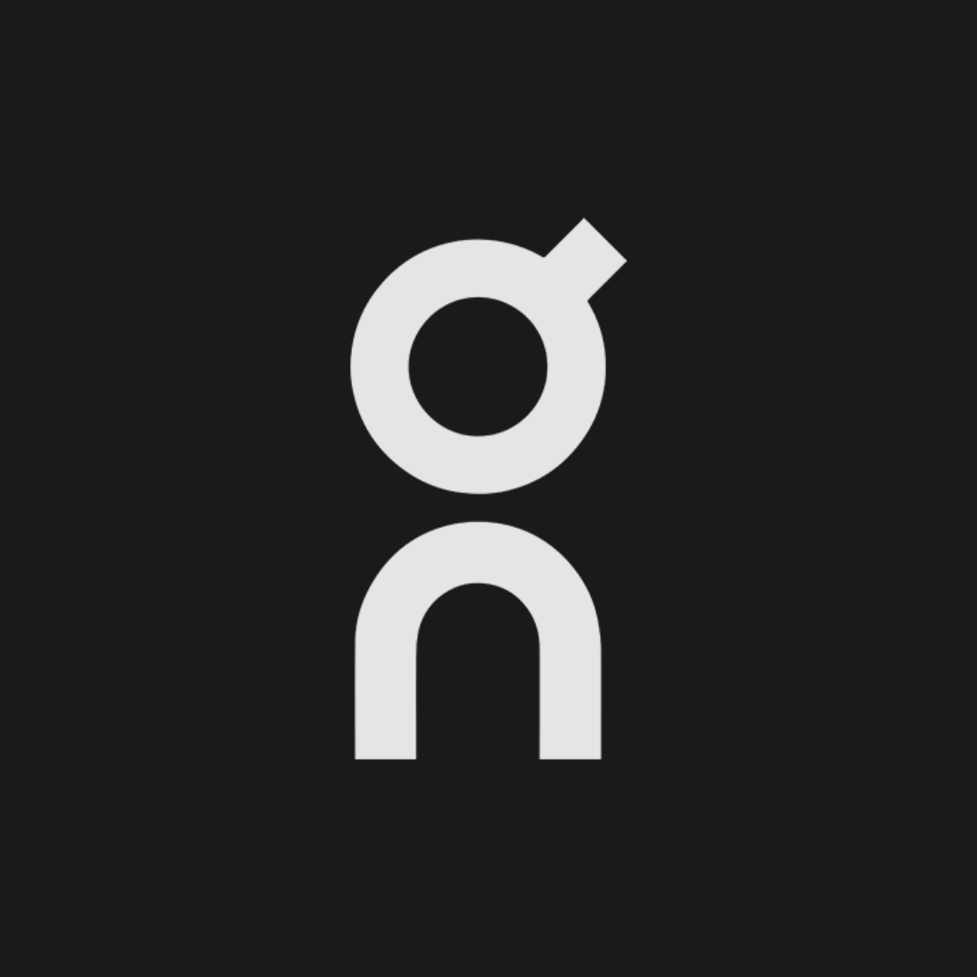 White abstract logo on a black background, resembling a stylized person or symbol.