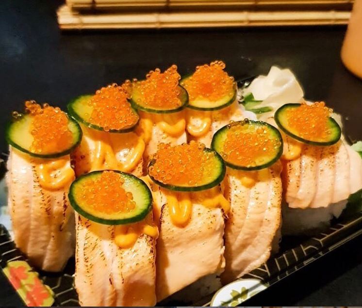 sushi chef cutting fresh fish for sashimi London