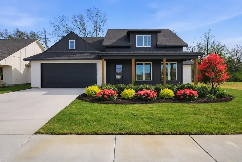 Modern farmhouse in Lafayette, LA with Zone 9 full‑sun landscape