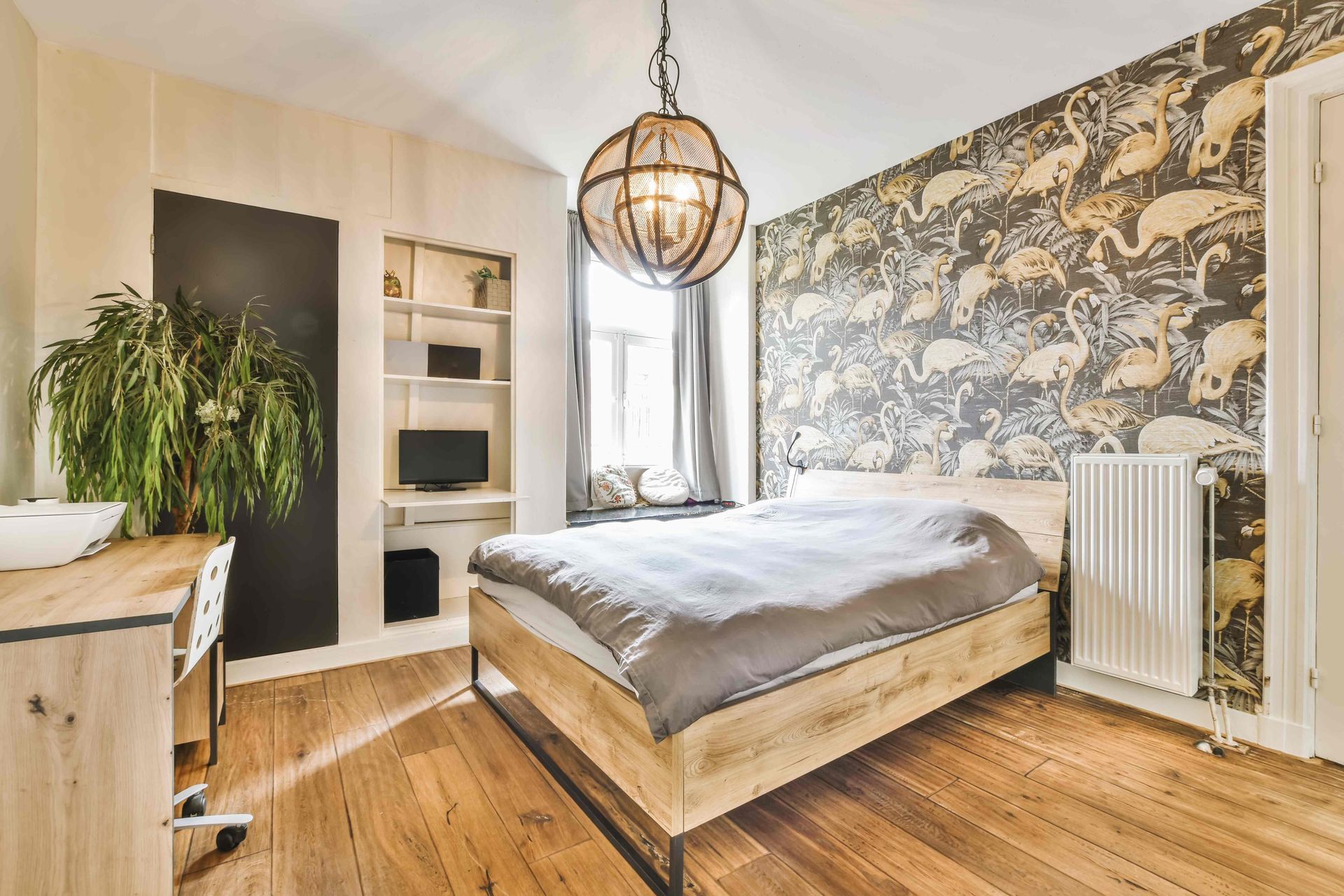 Accent wallpaper of a bird in a bedroom complementing the bedspread and window curtains at Rachel Brosky Interiors near Elizabethtown, Kentucky (KY)