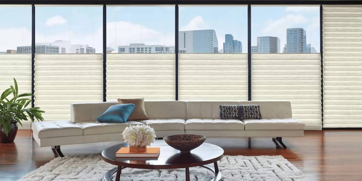 Hunter Douglas Top-Down/Bottom-Up Window Treatment in a modern living room overlooking a city skyline near Elizabethtown, Kentucky (KY)