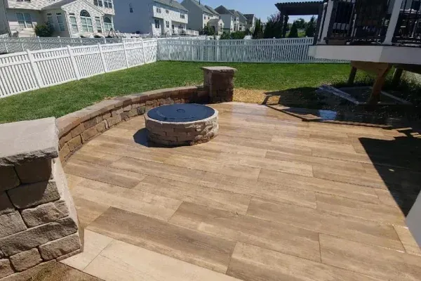 Custom backyard fire pit in Spring Grove PA enhancing outdoor living areas with a cozy focal point for relaxation