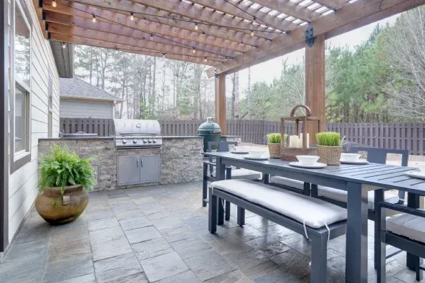Custom backyard outdoor kitchen in Spring Grove PA designed for grilling dining and outdoor entertaining