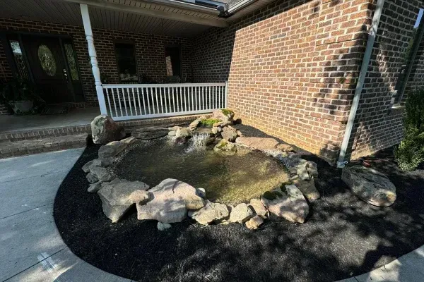 Custom backyard pond design in Spring Grove PA enhancing outdoor spaces with natural looking aquatic features