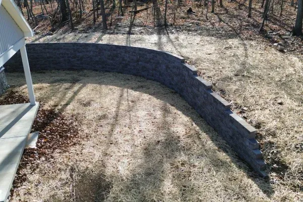Custom stone retaining walls in Spring Grove PA enhancing outdoor design while stabilizing sloped yard areas