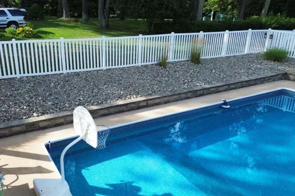 Decorative river rock installation in Spring Grove PA enhancing garden beds with long lasting natural stone ground cover