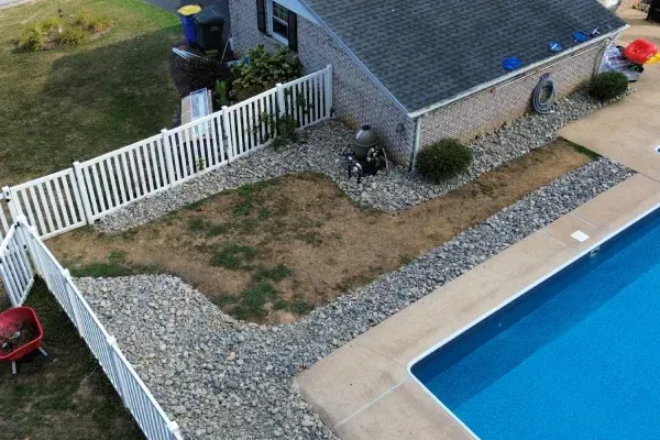 Landscape bed rock and mulch installation in Spring Grove PA improving curb appeal with decorative ground materials