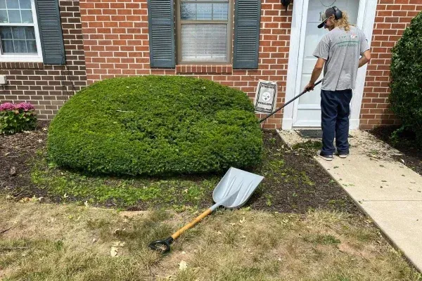spring landscape cleanup in Spring Grove PA improving curb appeal by clearing leaves branches and yard waste