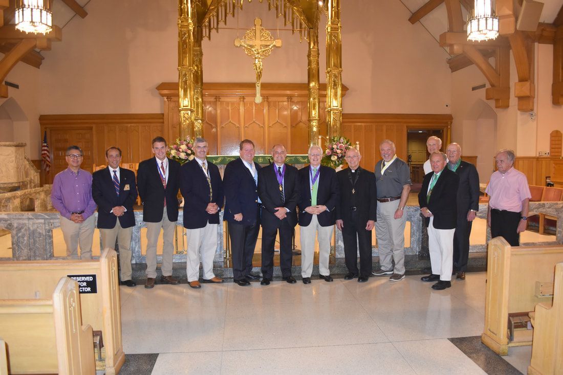 A group of men are posing for a picture in a church