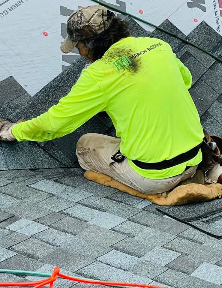 Worker performing shingle installation. Man installing Shingles. Local Shingle Installer.